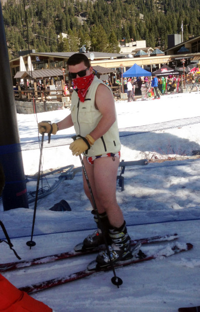 Guy skiing in boody shorts