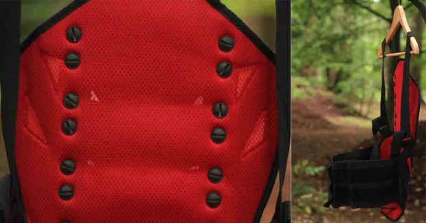 Plastic screws hold the hard plastic segment to the garment. The inside mesh material is comfortable and breathable. 