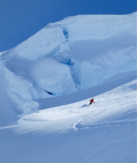 Client Joe Campbell skis great snow below the summit seracs.  photo:  Chris Davenport