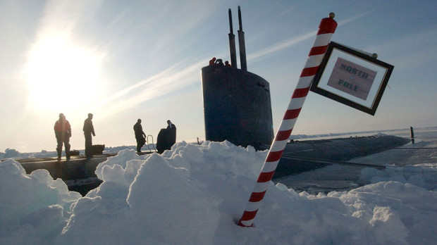 The crew of the Los Angeles-class attack submarine USS Hampton (SSN 767) posted a sign reading "North Pole" made by the crew after surfacing in the polar ice cap region.