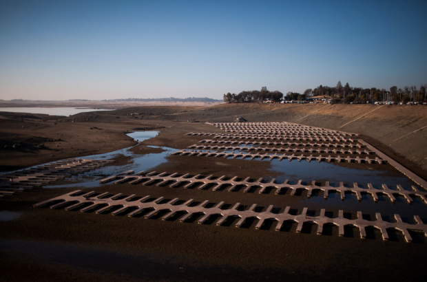 At Folsom Lake in California, which is at 17 percent of capacity, the marina sits on dry land and an abandoned town from the 19th century has resurfaced.  photo:  Max Whittaker for The New York Times