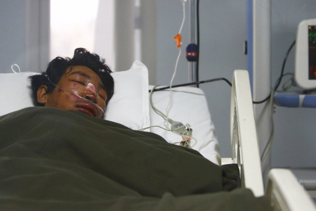 Dawa Tashi Sherpa lies on the bed of the Intensive Care Unit at Grandi International Hospital after he was rescued and airlifted from the avalanche site at Mount Everest in Kathmandu April 18, 2014.