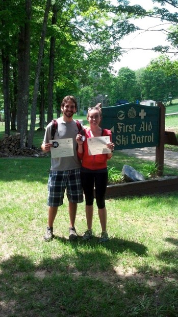 Aaron and his fiancé showing off their re-certification for the National Ski Patrol