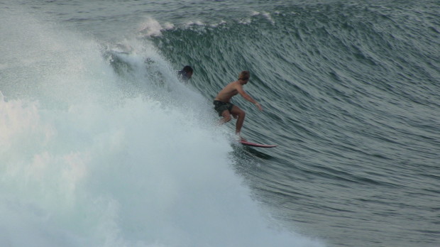 Getting dropped in on by a sponger at Padang Padang, Bali.  July 8th, 2014