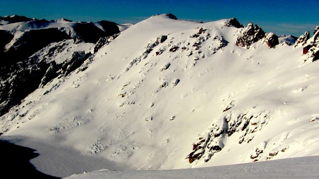 South face of lower La Laguna showing large avalanche debris piles at its base today.  photo:  snowbrains.com