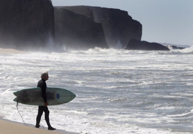 Surfer at Martins beach after a court order opened it to the public this week.