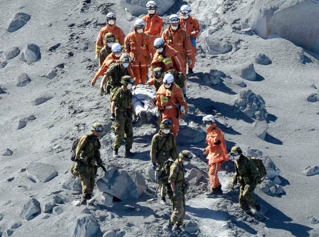 Dead being brought down Mt. Ontake, Japan. photo; ap
