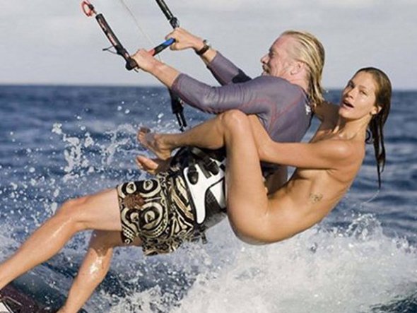Richard Branson kite surfing with naked girl