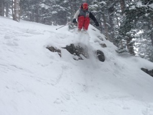airing off a rock into over a foot of powder