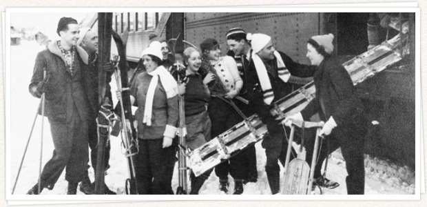 Skis and skiers coming off the "Snowball Special" train at Sugar Bowl in the early 1940s.