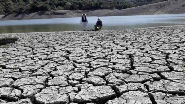 The dry bed of the Stevens Creek Reservoir is seen on Thursday, March 13, 2014, in Cupertino, Calif. (AP Photo/Marcio Jose Sanchez)