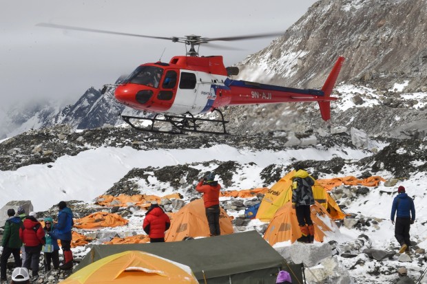 Injured climbers and Sherpa being airlifted from basecamp yesterday. photo: afp