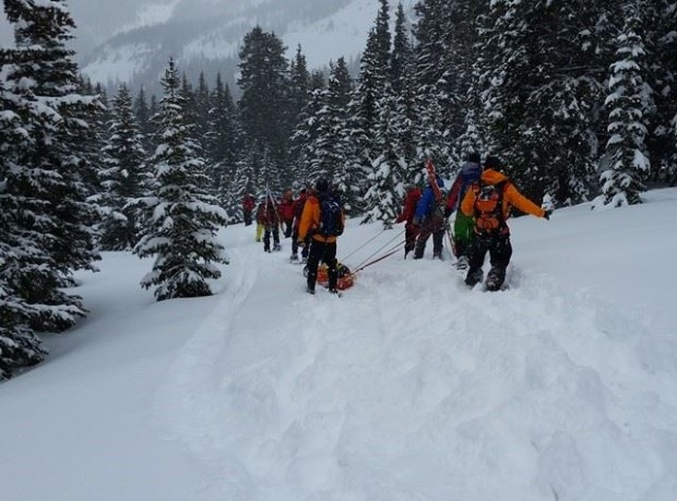 Grand Country SAR extracting the injured skier from the avalanche zone yesterday.