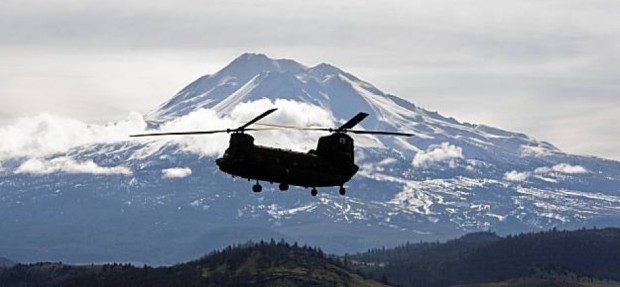 Stock photo of California Air National Guard Chinook helicopter returns to the Weed Airport after dropping off search and rescue personnel on a snow field near The Summit of Mt. Shasta.  photo:  AP