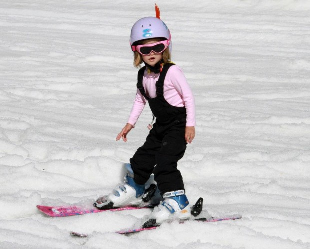 A young girl skiing.