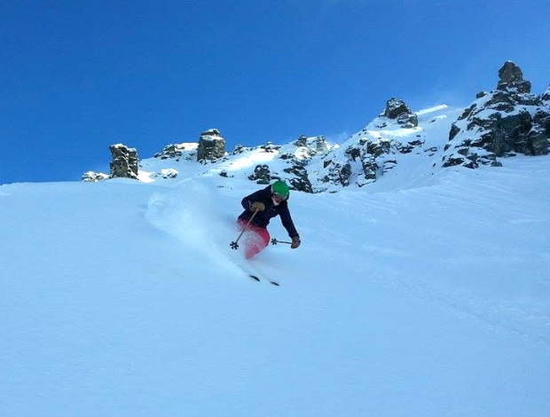 Athlete Marian Krogh skiing fresh snow in the Saddle Basin