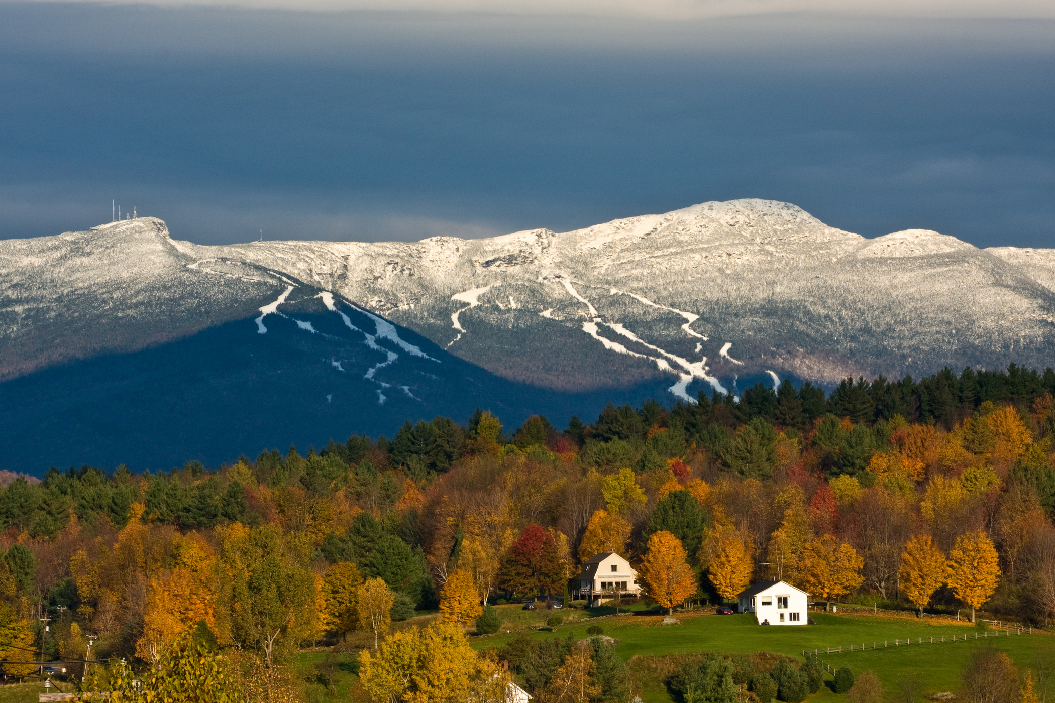 Stowe, Vermont with fall colors and snow.