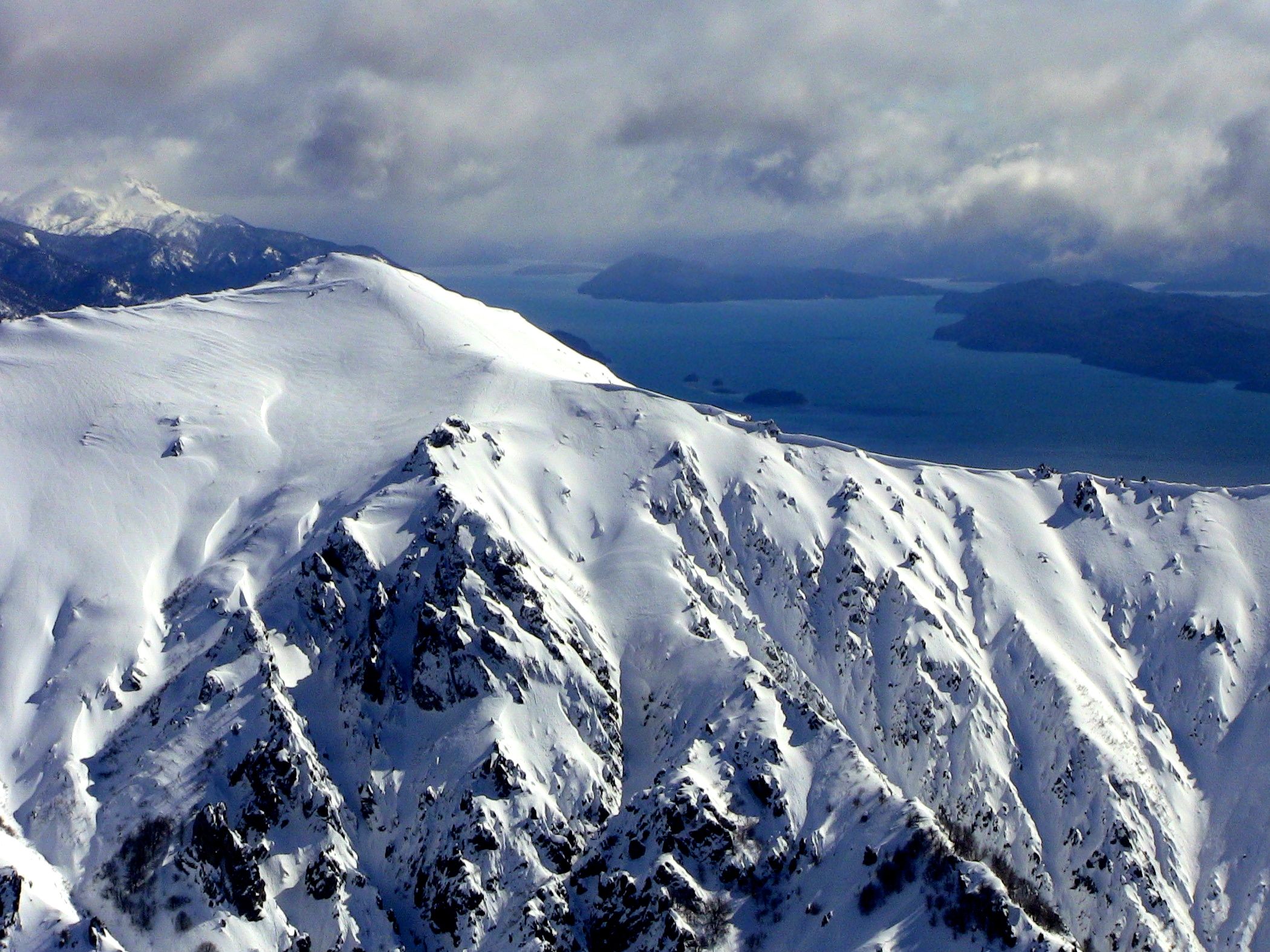Bella Vista peak and gorgeous Lake Nahuel Huapi in Bariloche, Argentina as seen from Catedral ski resort. photo: miles clark/snowbrains