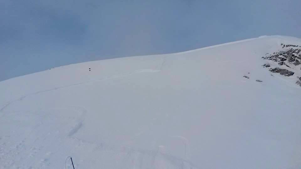 Photo of the crown and stanchwall of the avalanche that buried the snowmobilier. photo: ben anderson via facebook