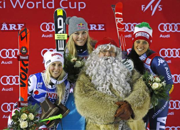 Lindsey on the podium with Santa Claus today AP Photo/Giovanni Auletta