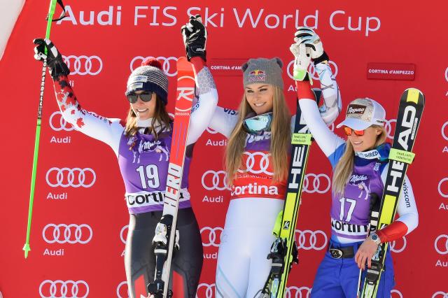 Vonn stands atop the podium, flanked by Larisa Yurkiw and Lara Gut. (Getty Images/Agence Zoom-Francis Bompard)