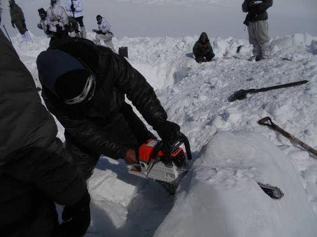 Using chainsaws in the rescue mission.  image:  indian army