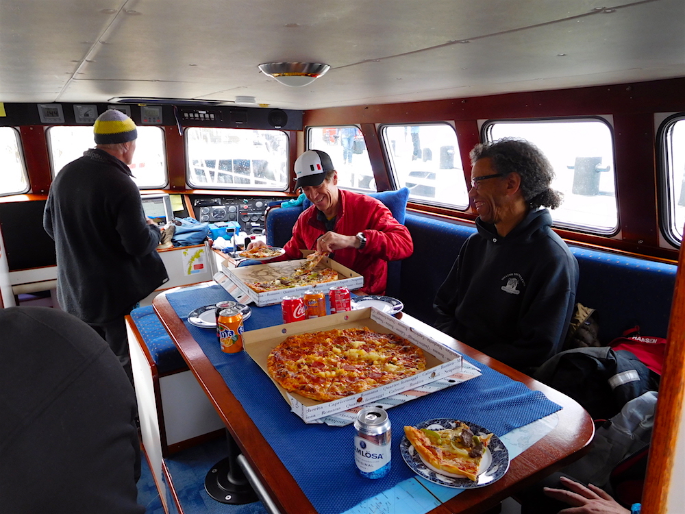 Pizza and smiles before our initial sail. photo: snowbrains