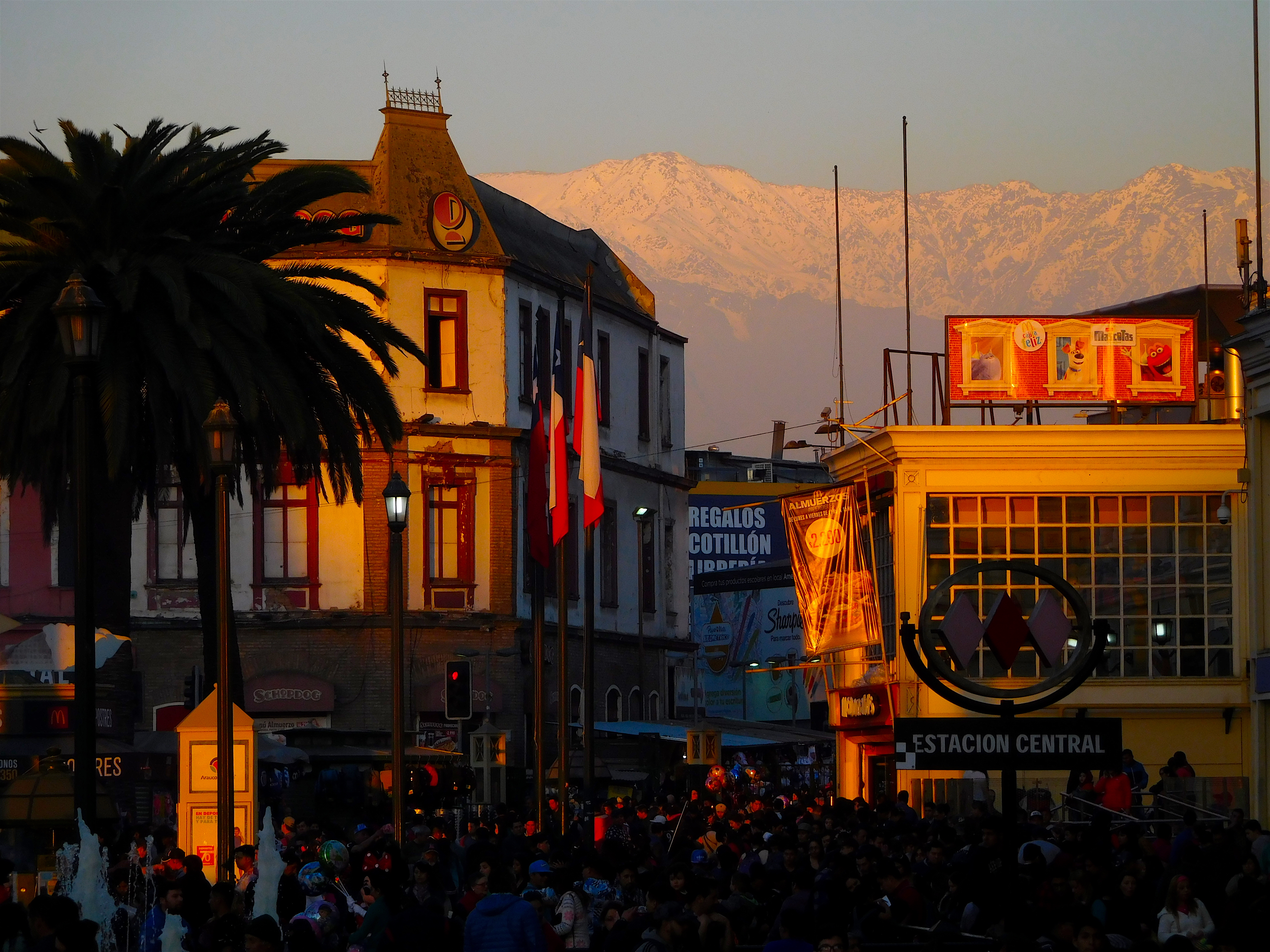 Alepnglow on the huge peaks that loom above Santiago's packed central train station area. photo: snowbrains
