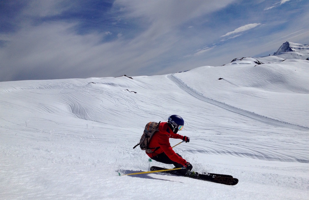 Client Robert tearing it up with the fun runnels in the background. photo: snowbrains