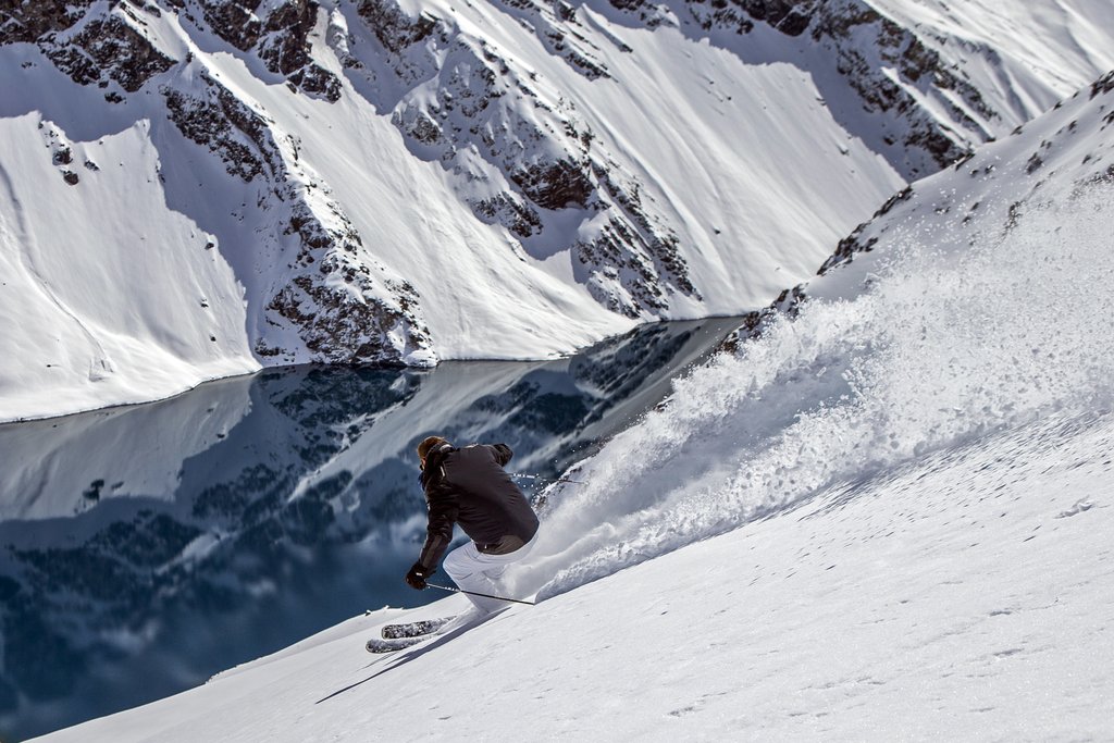 Bode Miller slashing some beautiful Chilean pow above lake in Ski Portillo. Source; Bomber Ski.