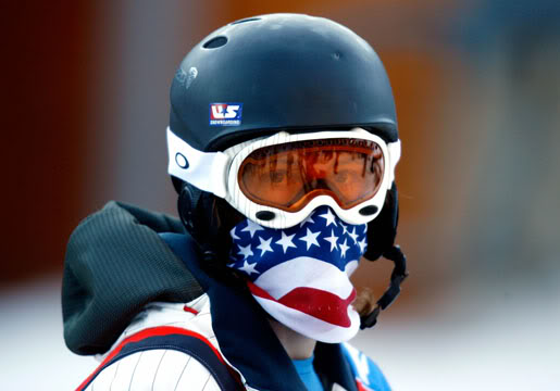 Shaun White of the U.S. wears a scarf during qualification in the men's half pipe snowboarding competition at the Torino 2006 Winter Olympic Games in Bardonecchia, Italy February 12, 2006.    REUTERS/Eric Gaillard