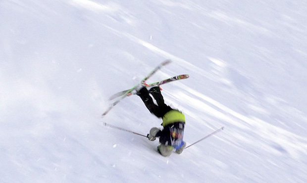 Skier crash with helmet on.