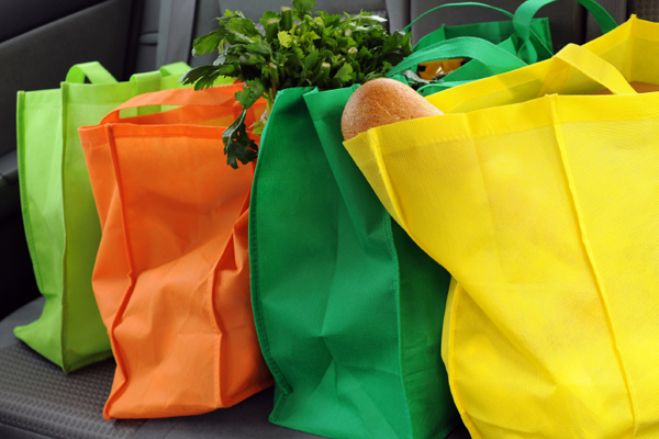 Cotton reusable grocery bags, like those above, are most popular with shoppers. Photo: Star Tribune