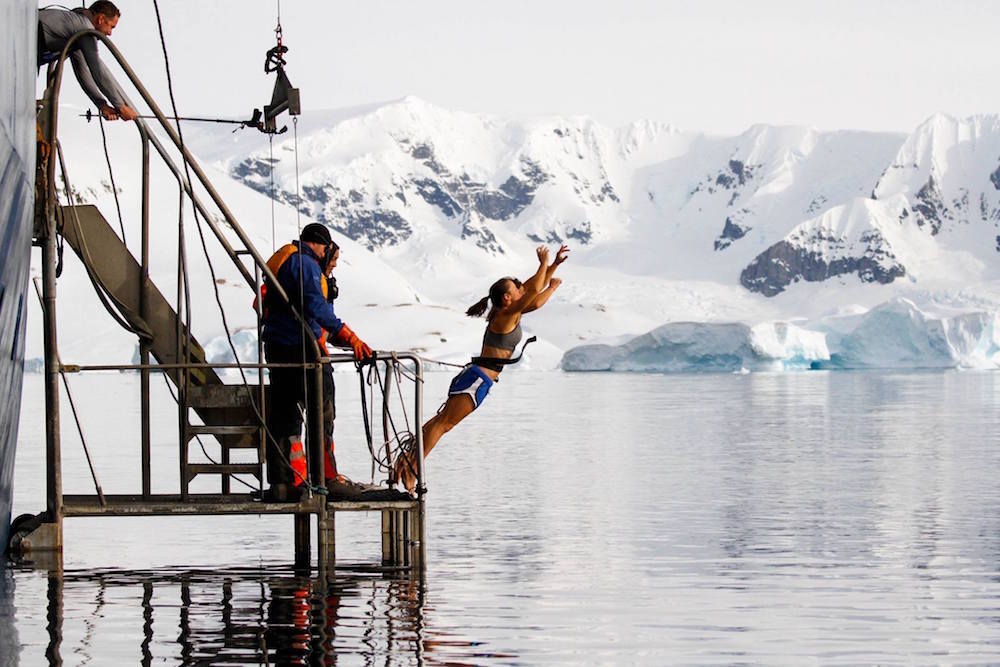 Identical twins Theresa and Rachie first in for the Polar Plunge. image: Court Leve/Ice Axe Expeditions 