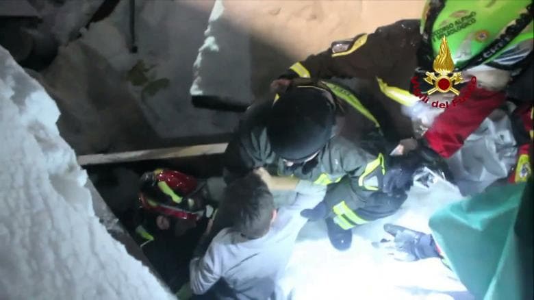 A still image taken from a video shows a survivor, rescued by Italian firefighters, at the Hotel Rigopiano in Farindola, central Italy, which was hit by an avalanche, in this January 21, 2017 handout provided by Italy's Firefighters. Vigili del Fuoco/Handout via REUTERS