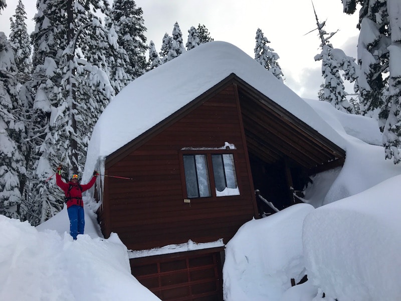 Chuck and a buried house in Alpine. image: snowbrains