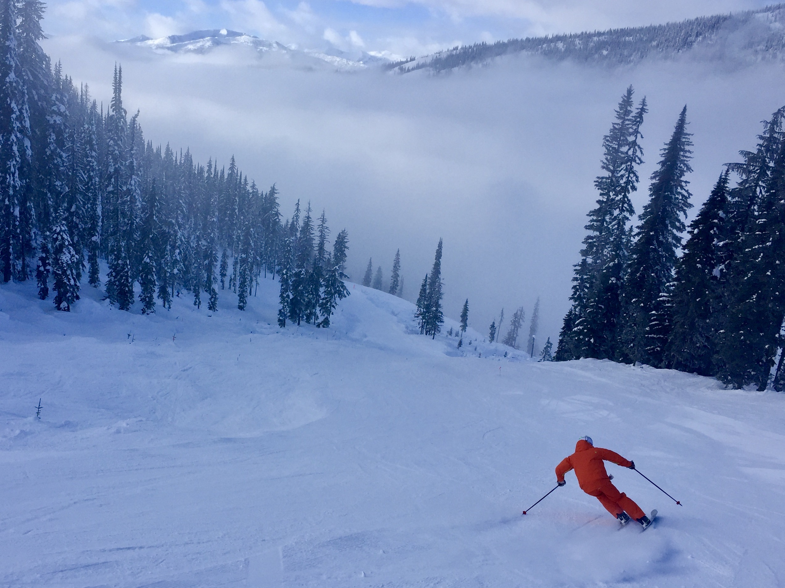 Carving into the clouds on the sweet snow on the backside of the mountain. 