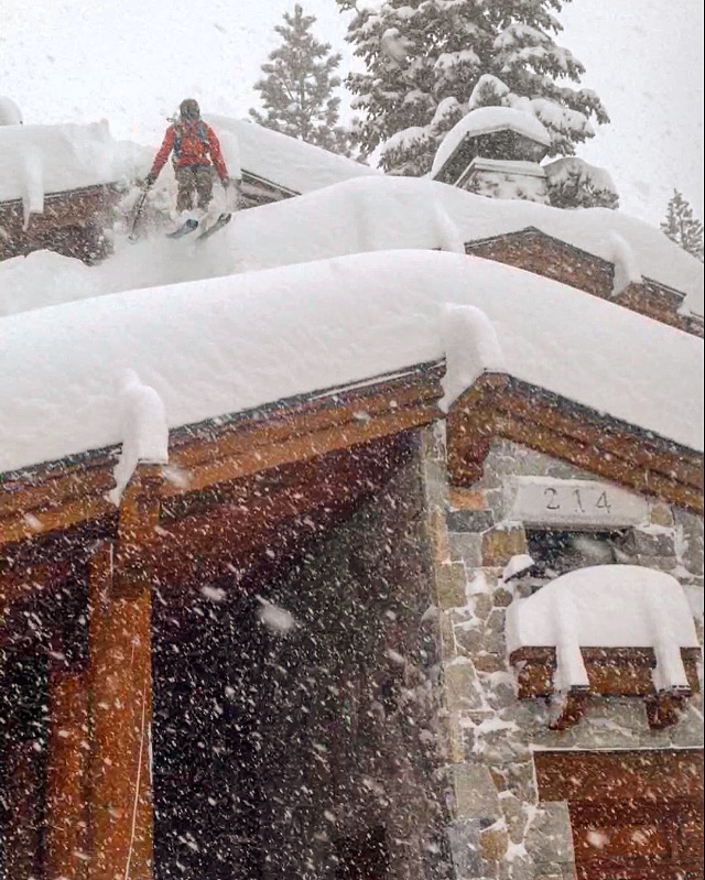 Skiing a sweet pillow line down a multi-roofed cabin. Skier: Bevan Waite. Pic: John Rarick