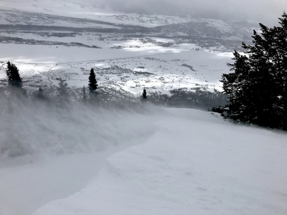 Wind ripping off a cornice off Thunder today. photo: snowbrains