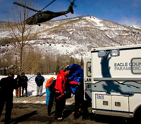 Blackhawk helicopter transporting the injured skier.