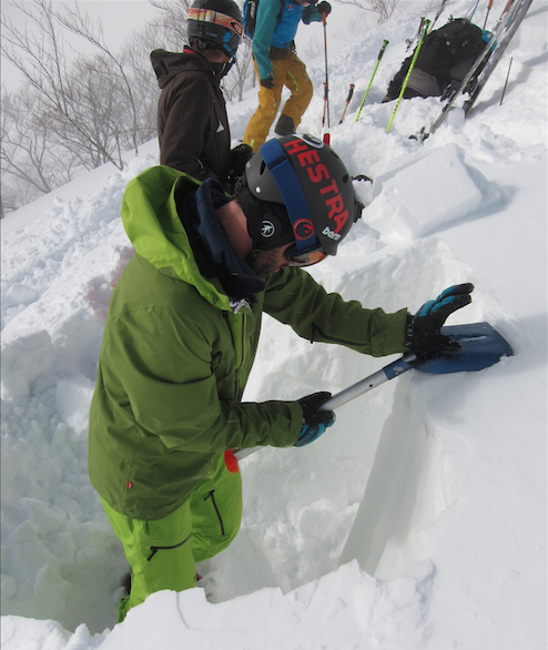 backcountry etiquette, Guide Miles Clark digging a snow pit in Japan on an unstable day.