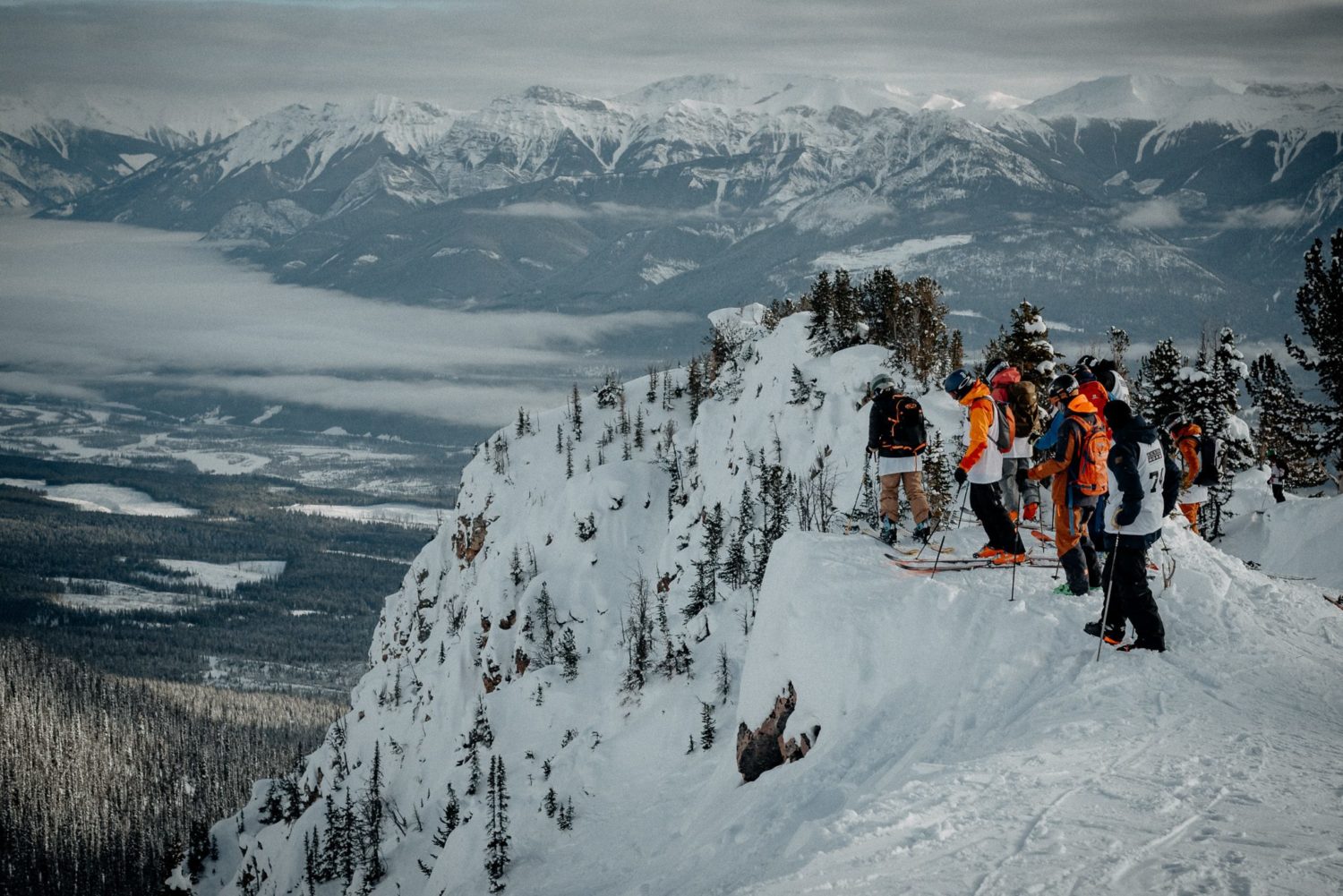 Skiers line up before dropping into the Freeride World Qualifiers