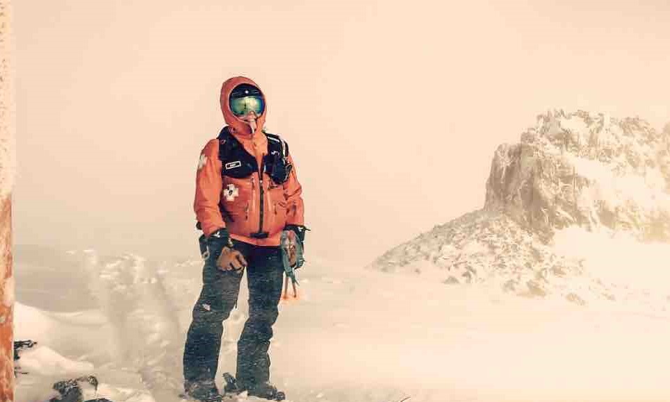 Amy in ski patrol uniform up on emigrant ridge