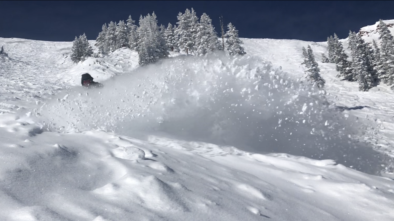 Aspen Highlands Bowl skier in deep powder snow