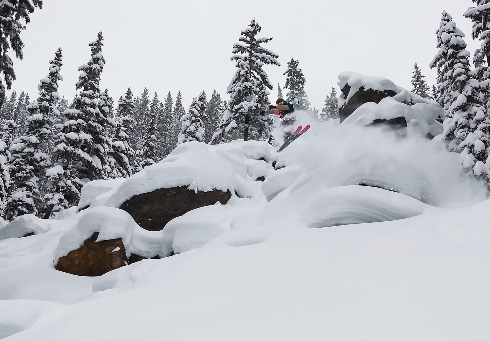 Skier slaying pillow with Black Crow skis