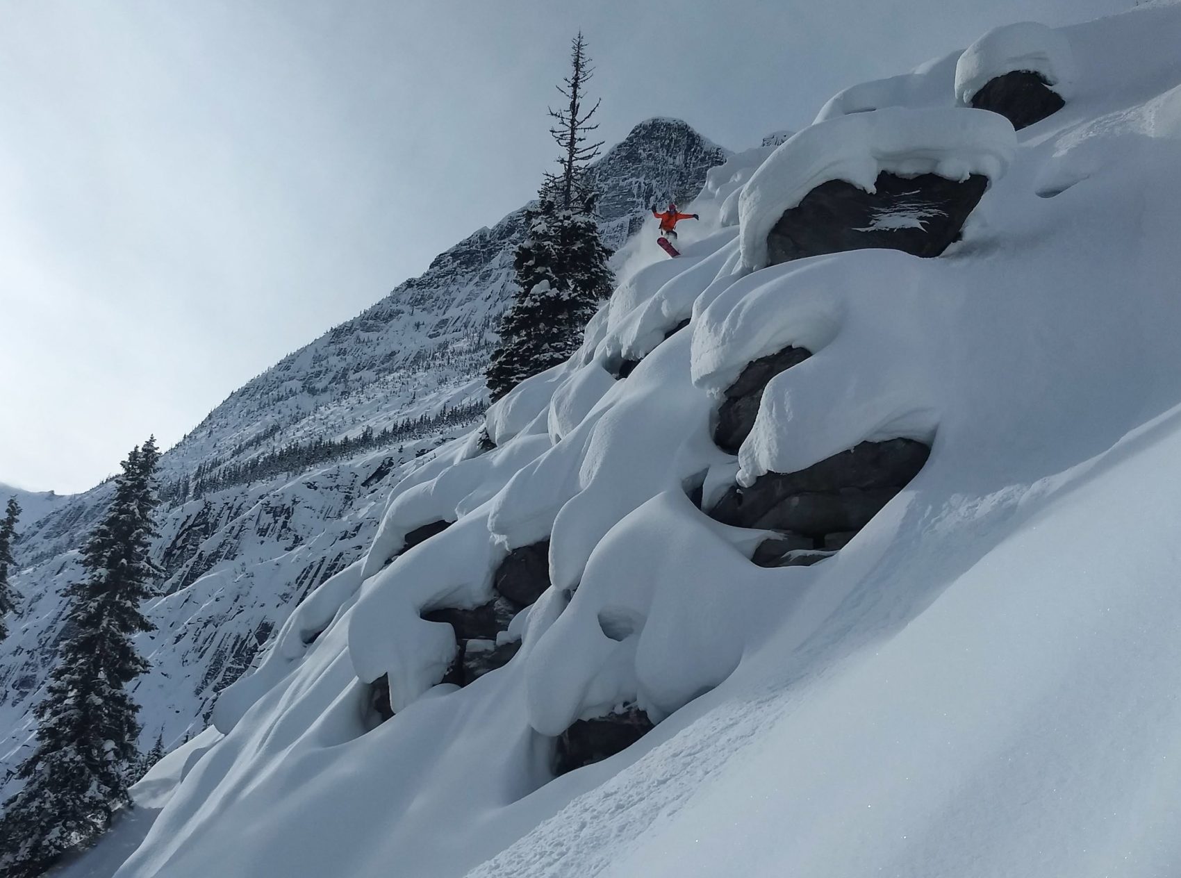 snowboarder on pillows in rogers pass