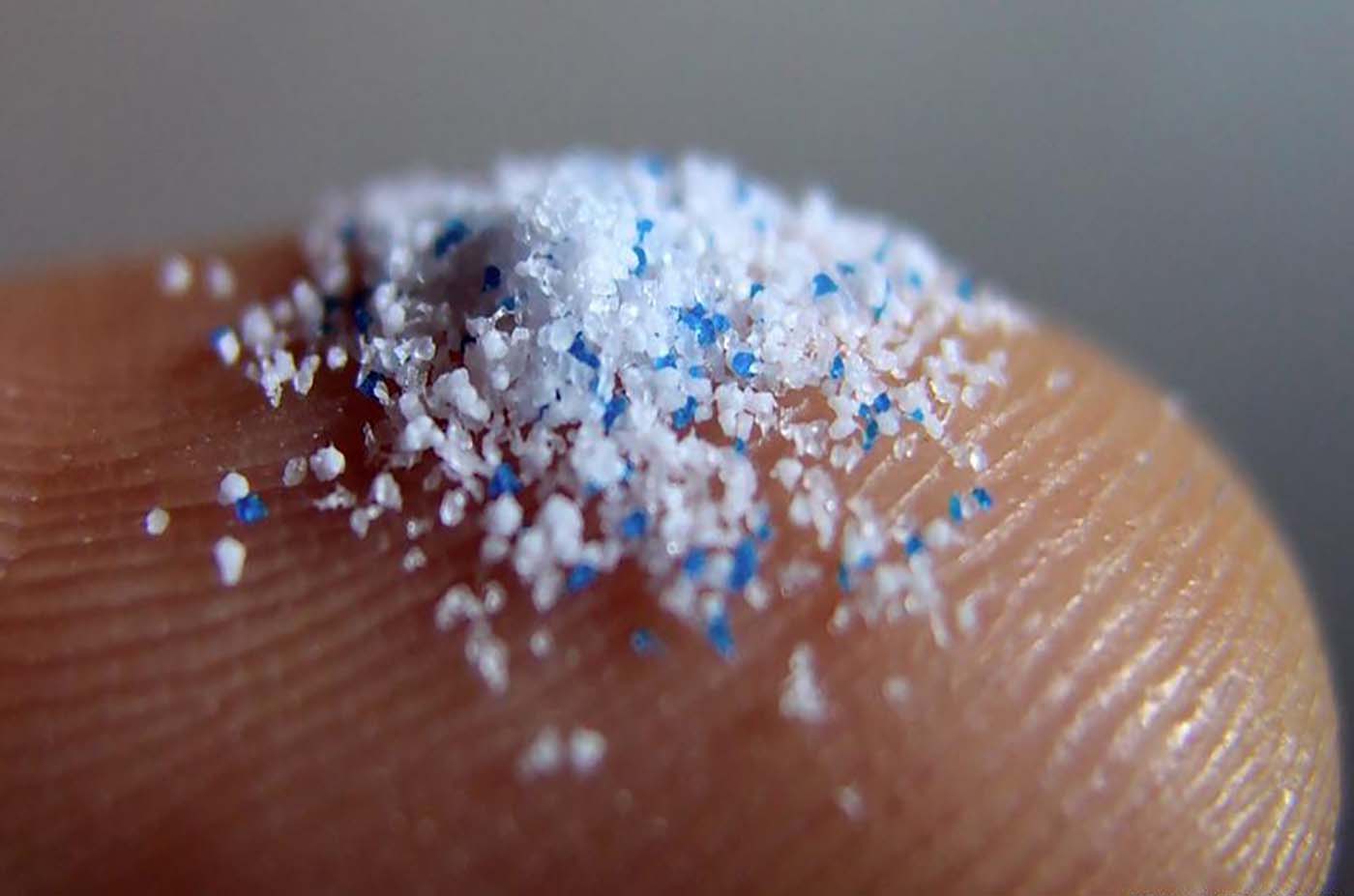 Microplastic on finger