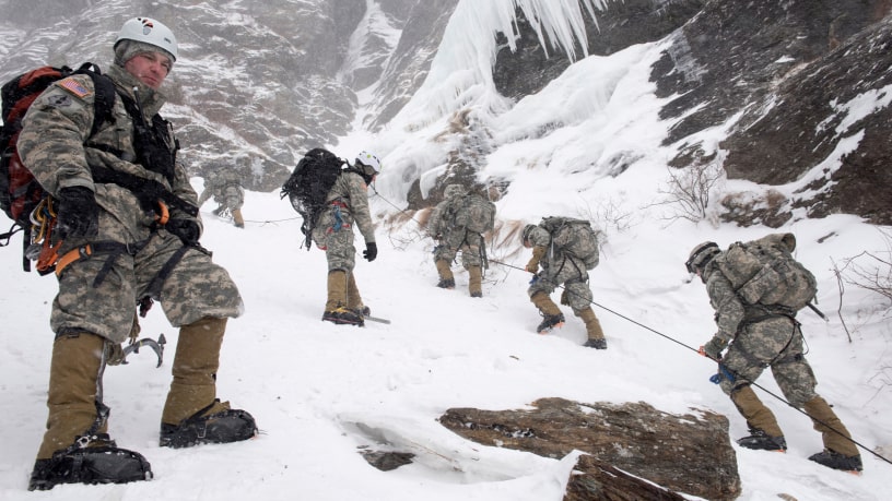 CPT Jason Beams, Army Mountain Warfare School in Jericho, VT, observes Soldiers climbing Smugglers' Notch during their final phase of the Basic Military Mountaineering course. (Photo by TSgt Sarah Mattison)