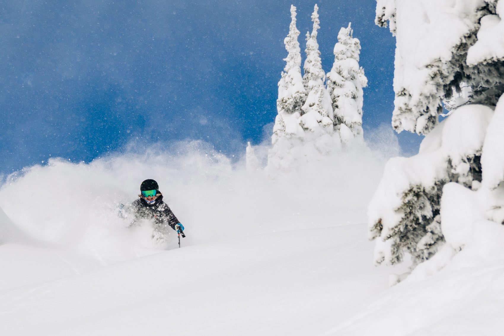 Skier in deep snow at Crystal Mountain, WA, one of the US's most Google ski resorts
