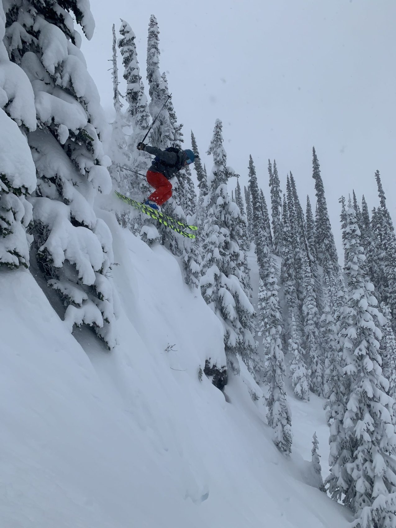 Skier jumping off a cliff